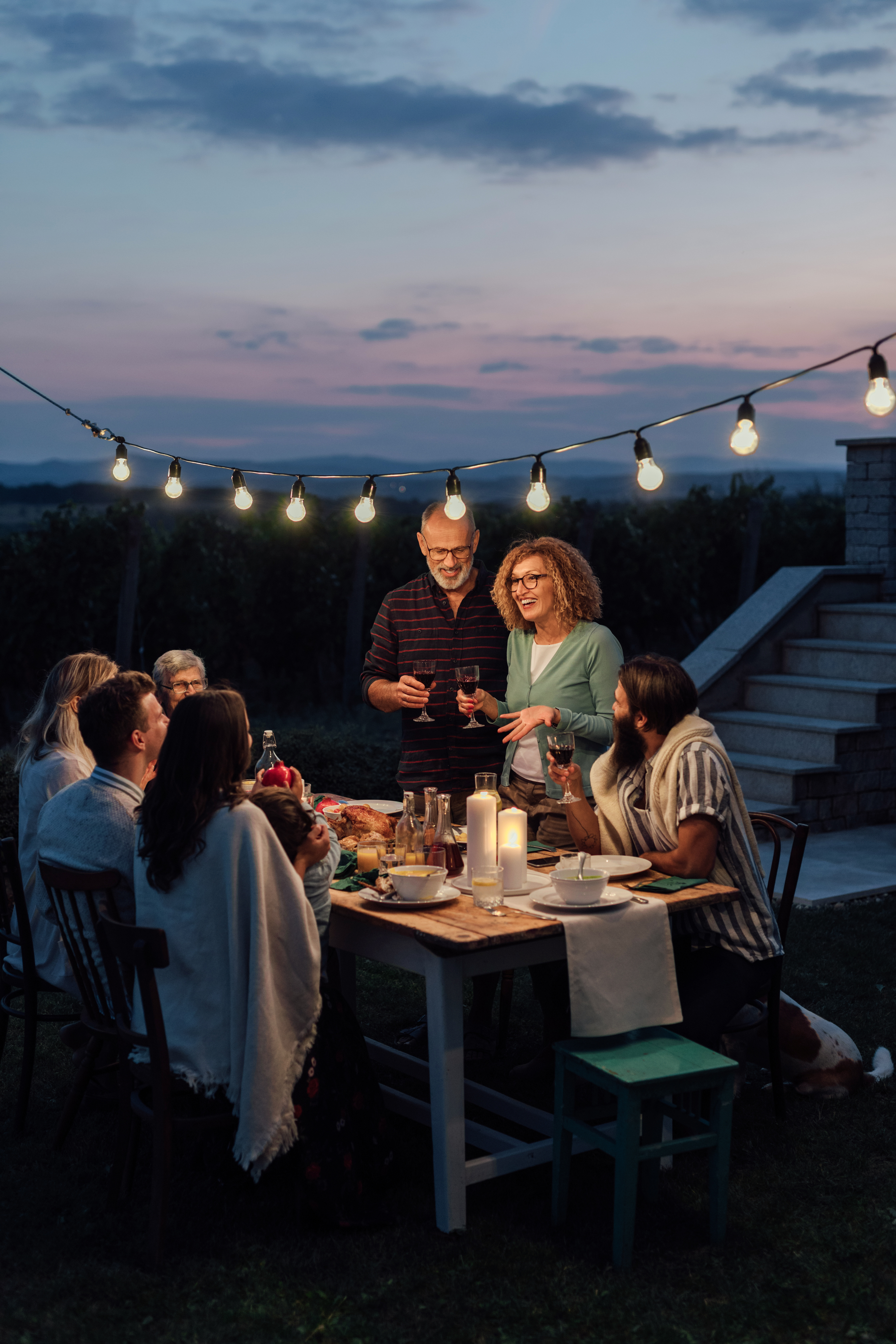 A newly retired couple celebrating with friends at dinner